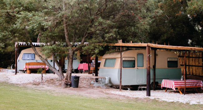 permanent caravans with braai facilities and a roofed area.